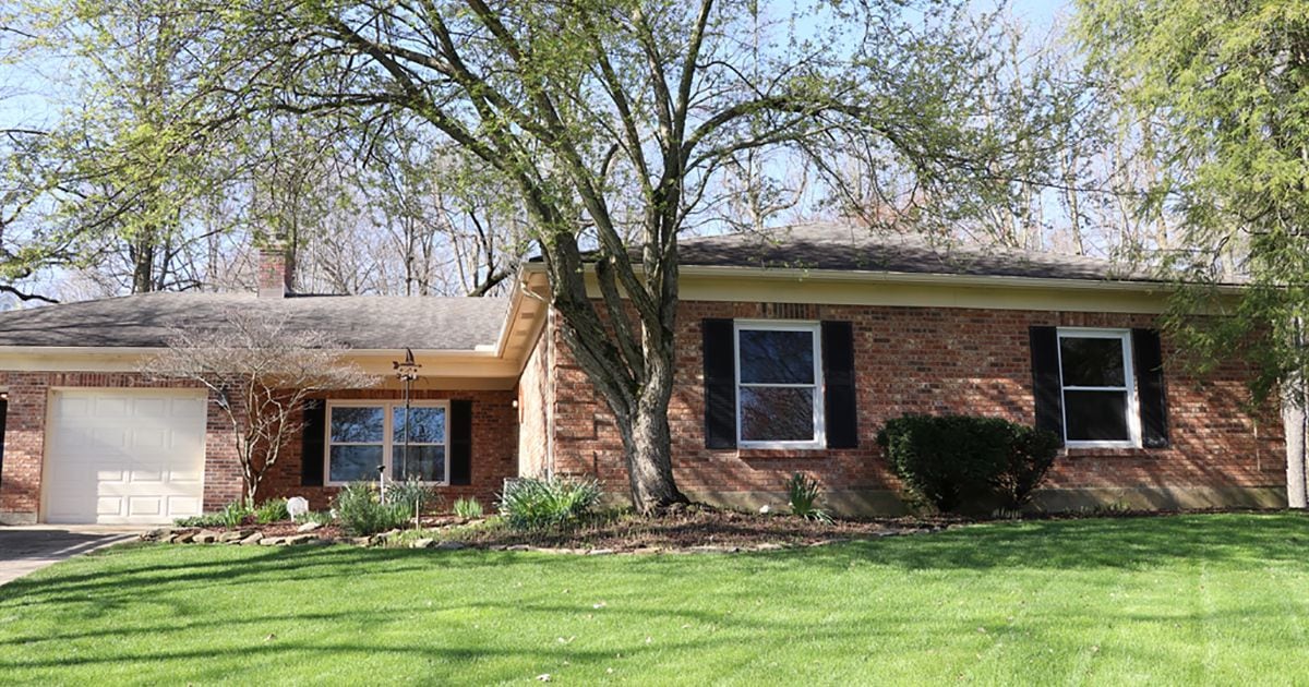 Brick ranch features 4-season room, 2 patios